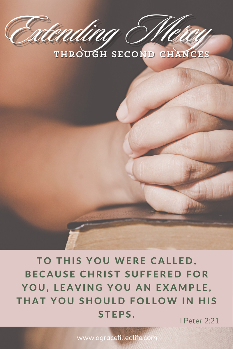 woman's hands folded over a bible, the words extending mercy through second chances at the top of the image, followed by the verse 1 Peter 2:21 which reads "to this you were called, because Christ suffered for you, leaving you an example, that you should follow in his steps"